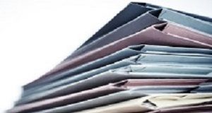 Clerical burden a huge driver of burnout in medicine Pile of business document files