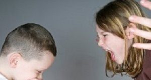 Sibling bullying triples risk of later psychotic disorders Older girl yelling at younger boy