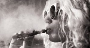 Vaping restrictions 'could be a public health disaster' Black and white picture of woman smoking e-cigarette