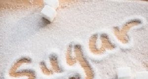 Sugar consumption in pregnancy linked to poorer childhood cognition Inscription sugar made into pile of white granulated sugar