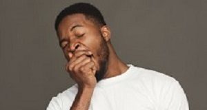 Day-time sleepiness linked to Alzheimer's risk Black man yawning on grey background, studio shot, copy space