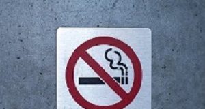 Smoke-free policies associated with lower blood pressure No smoking sign affixed to a wall on a building outside